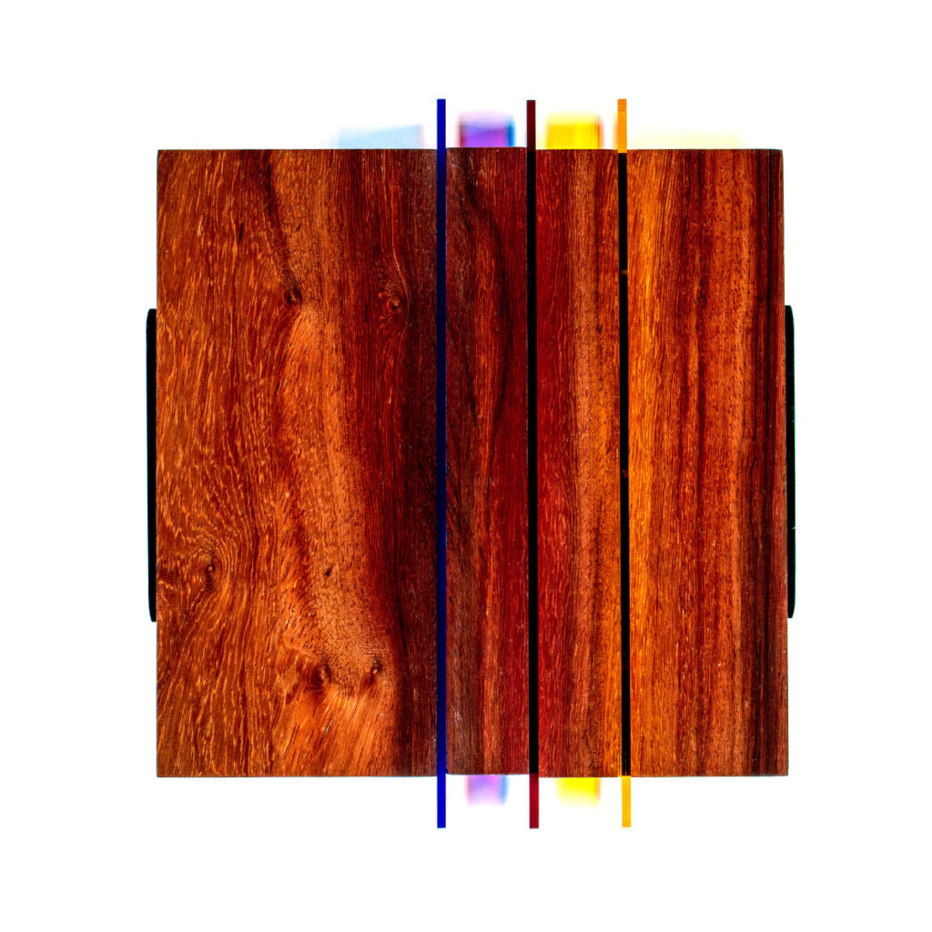 Wall sculpture titled S-020 made of Padauk wood with vertical acrylic sheets in blue, red, purple, yellow, and orange protruding through the wooden panel