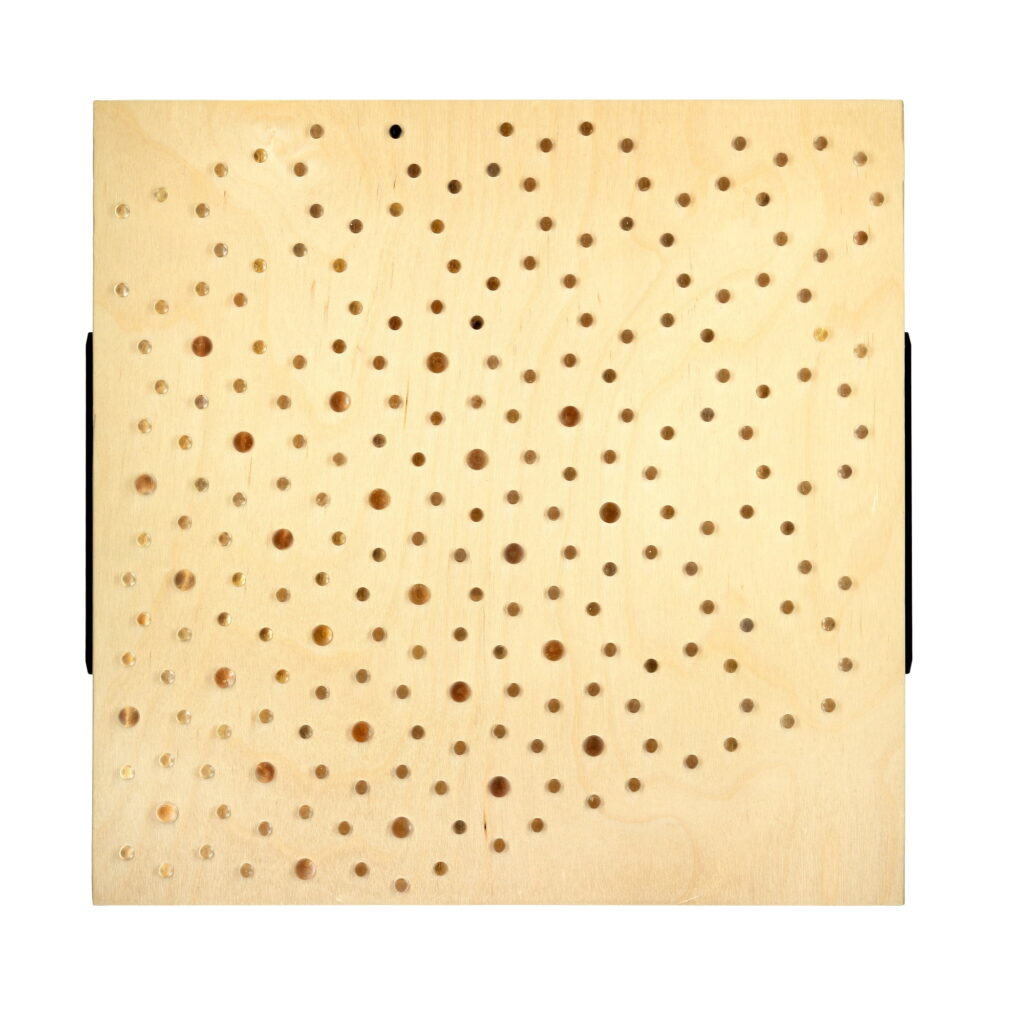 Wall sculpture titled M-004, made of birch plywood featuring a grid of various-sized holes with embedded translucent acrylic spheres, dated 2022.