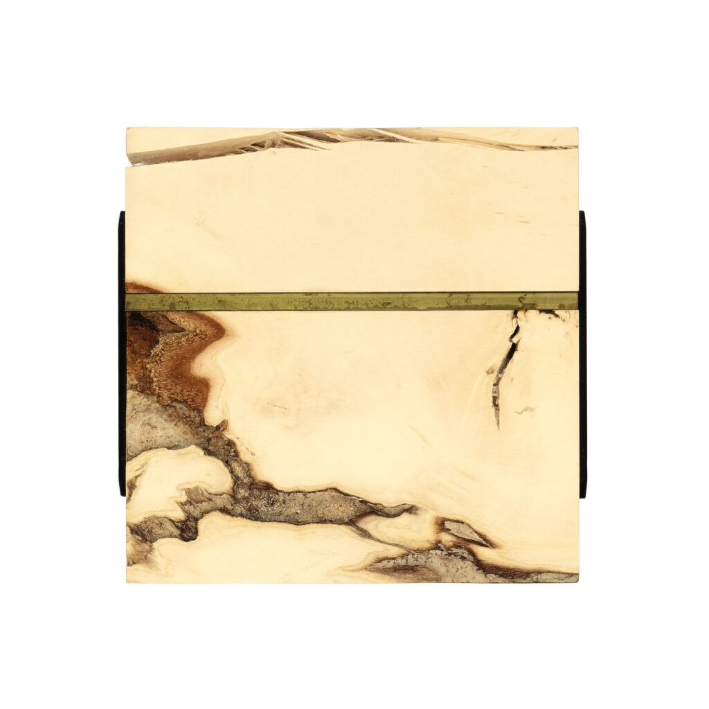 Wall sculpture S-008 made of holly wood featuring a square form with a natural wood grain pattern and a horizontal square brass tubing embedded near the top.