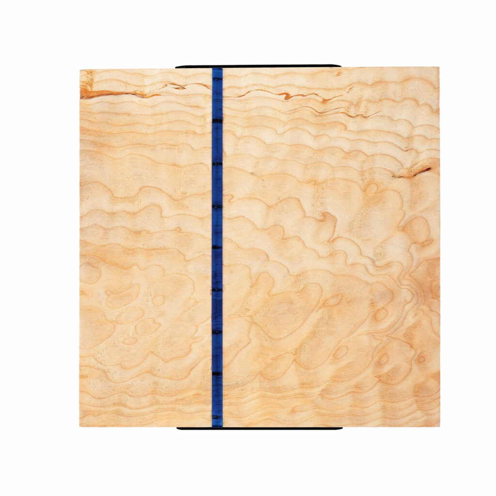 Wall sculpture titled 'S-021' made of quilted maple wood with a vertical blue acrylic rod near the center, measuring 8-3/4 x 8-1/2 x 1-1/8 inches, created in July 2020